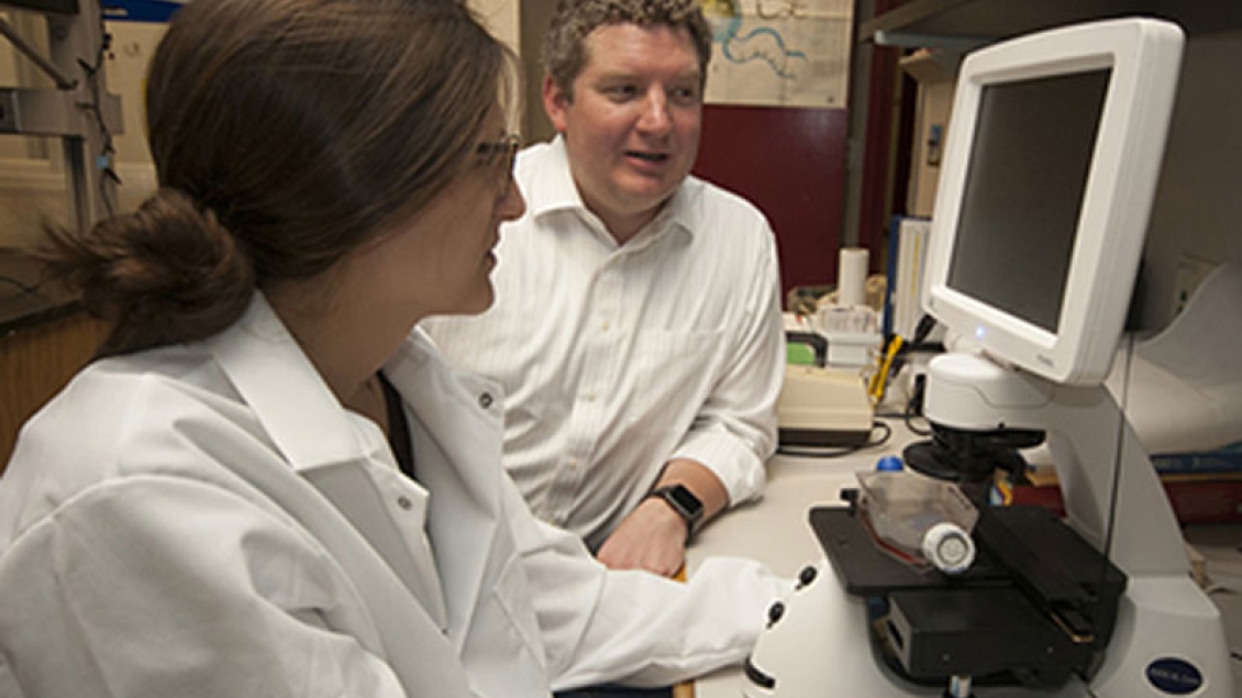 scientists in parker lad looking at samples 