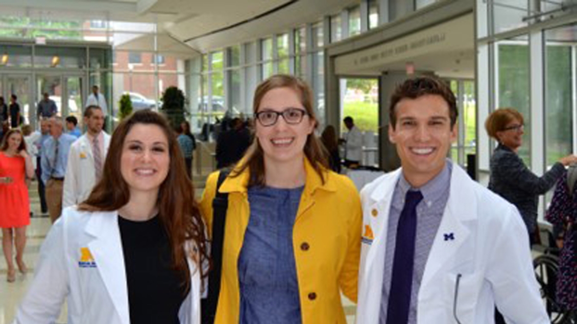 Picture of grads in coats at the white coat ceremony 