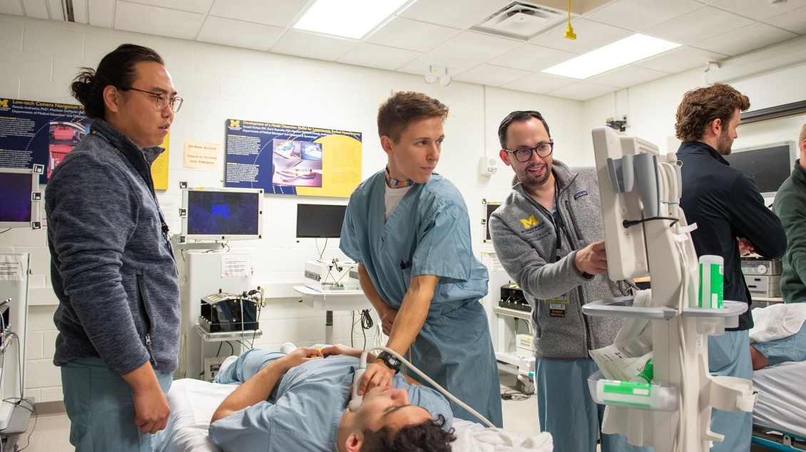 Surgical trainees use an ultrasound device in a simulation center