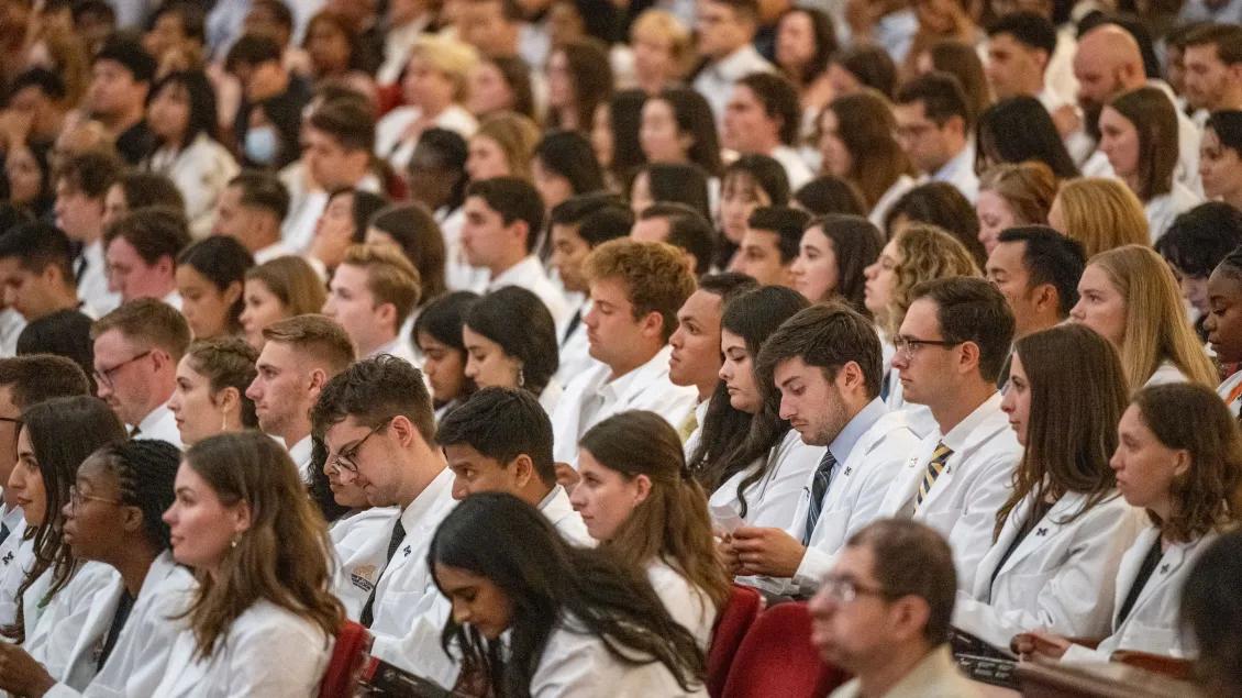 A large group of medical students attend their white coat ceremony