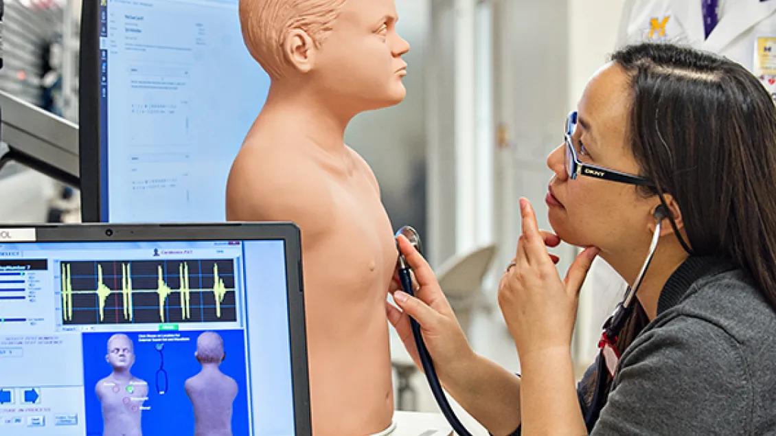 A person working with a lab dummy