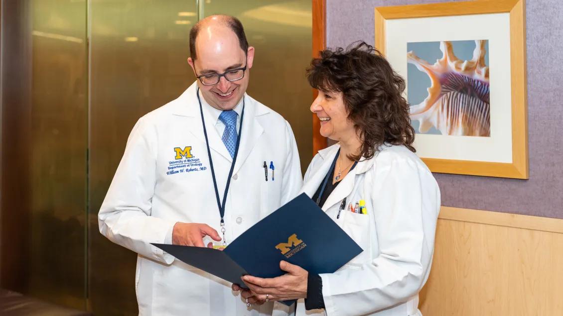 Two Endourology physicians look over a folder