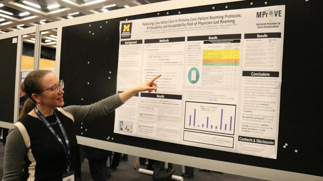 Dr. Oshman points to project poster