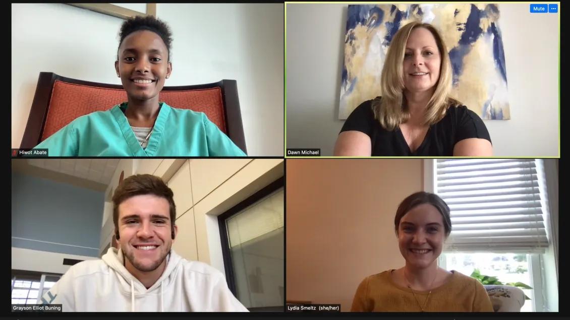 Four people in a virtual meeting