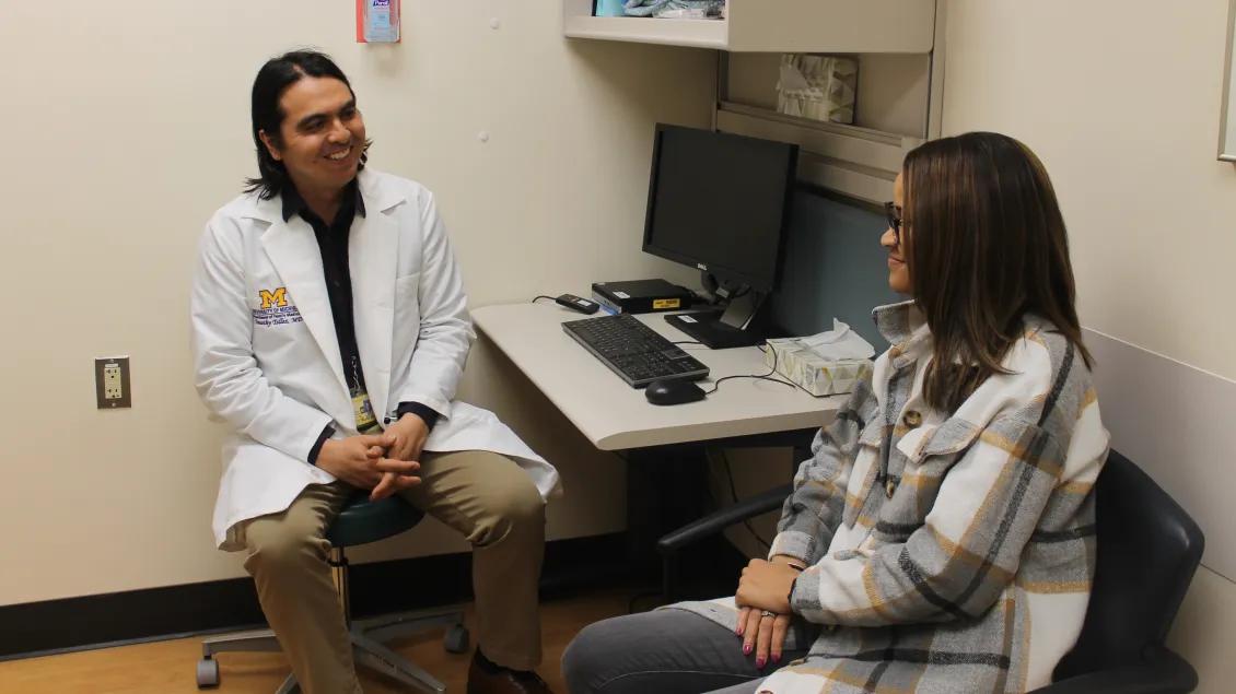 Male Family Medicine doctor speaks with a patient