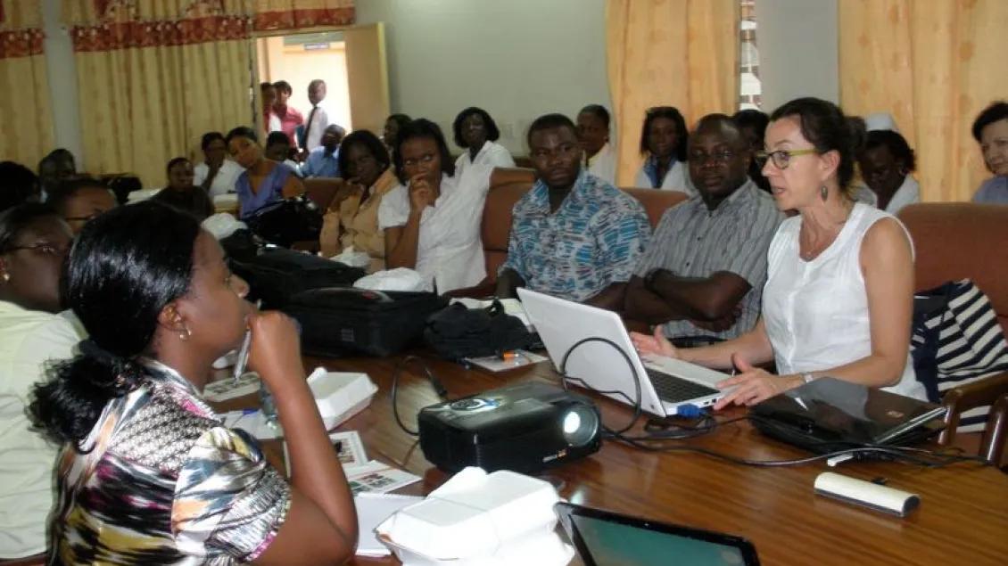 A large group of people at a table working