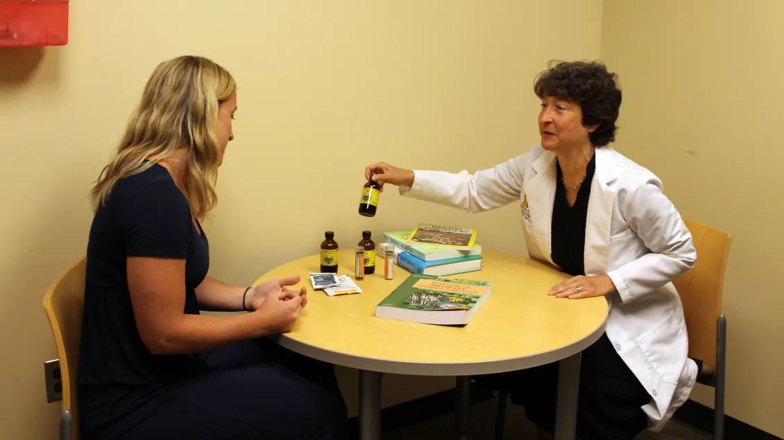 Provider talking to patient at a table