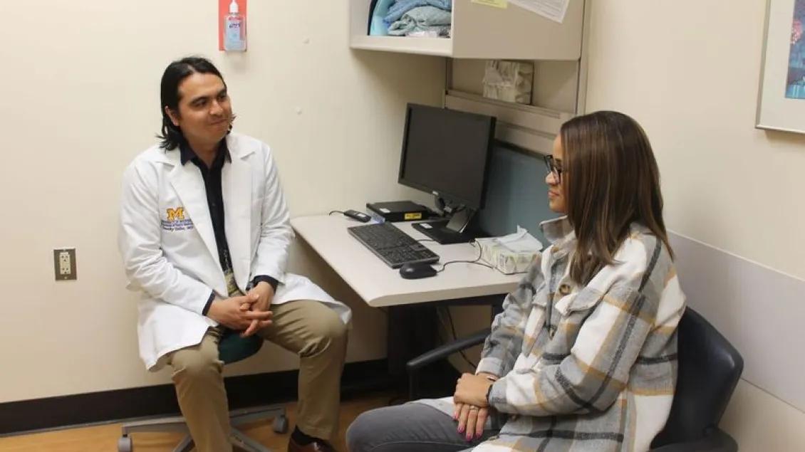 Two people sitting in an exam room