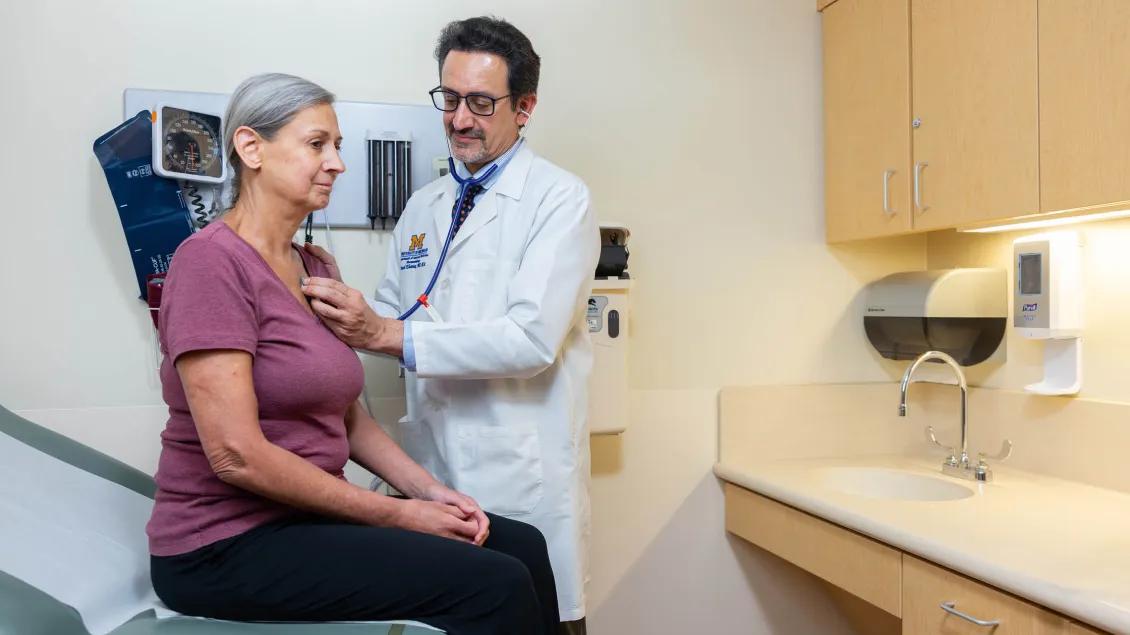 Dr. Dinesh Khanna with a patient