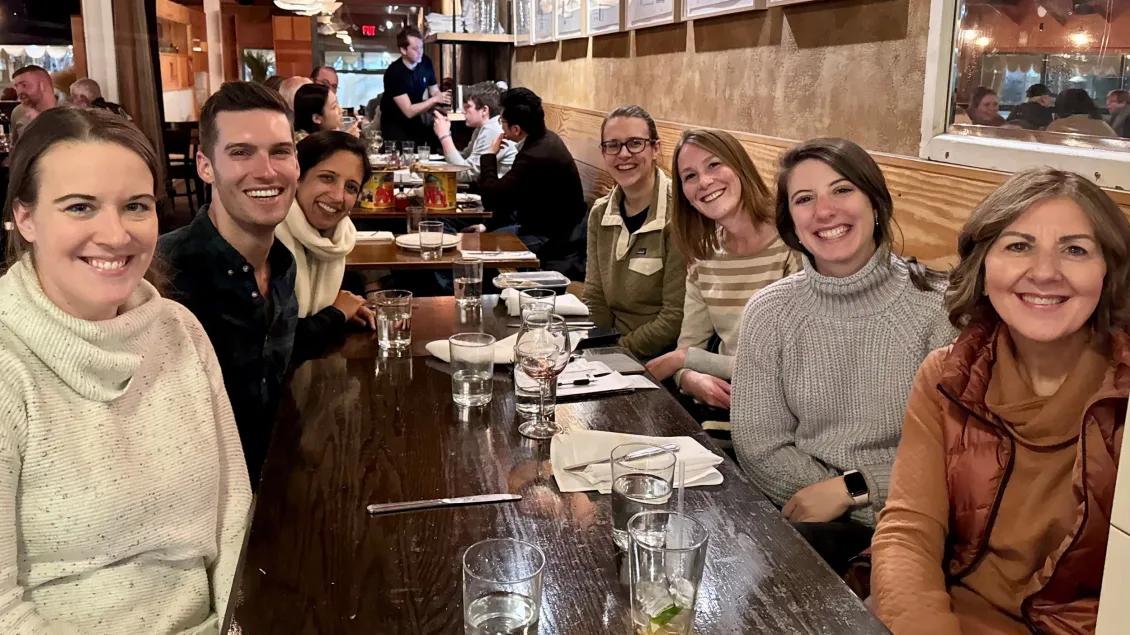 Pediatrics staff sitting at table at dinner outing