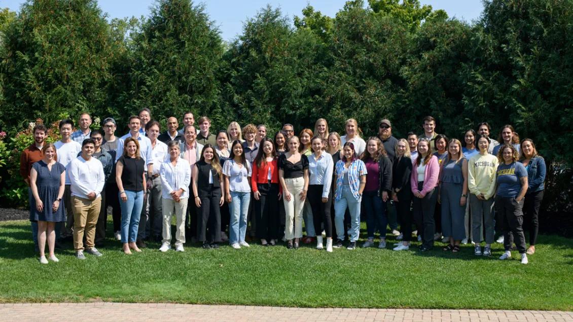 Research team poses for a group photo at the outdoor retreat