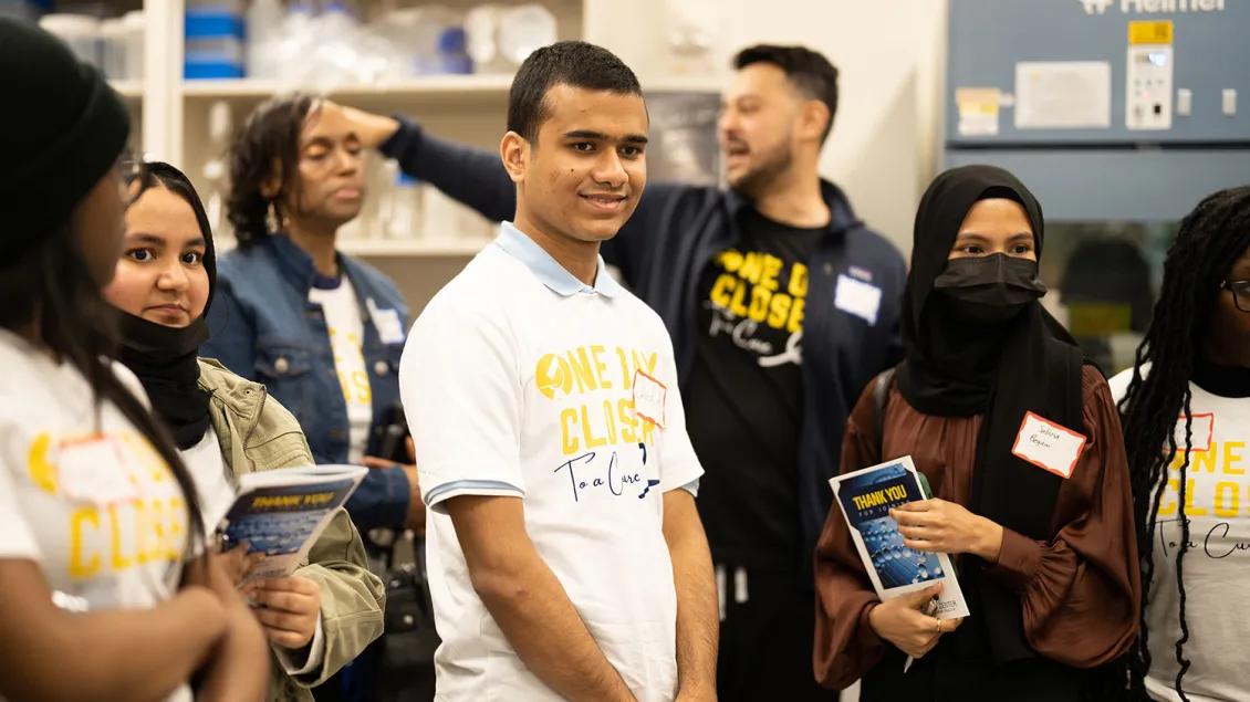 A group of students tours a laboratory during Rogel Cancer Center's One Day Closer event