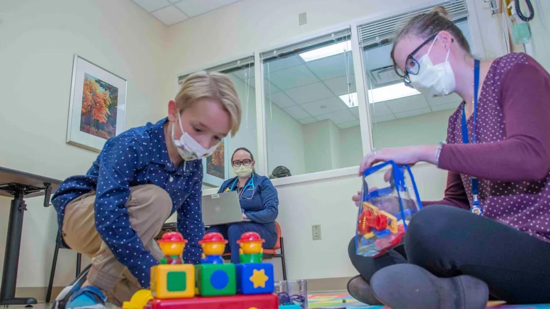 Developmental Behavioral Pediatrics team working with a patient