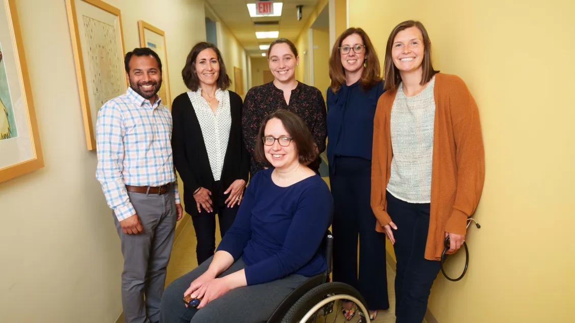 The Nephrology team posing for a photo in a hallway