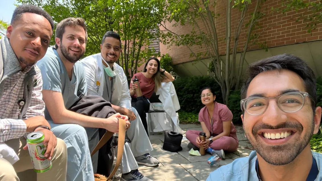 Ophthalmology residents sitting in the courtyard