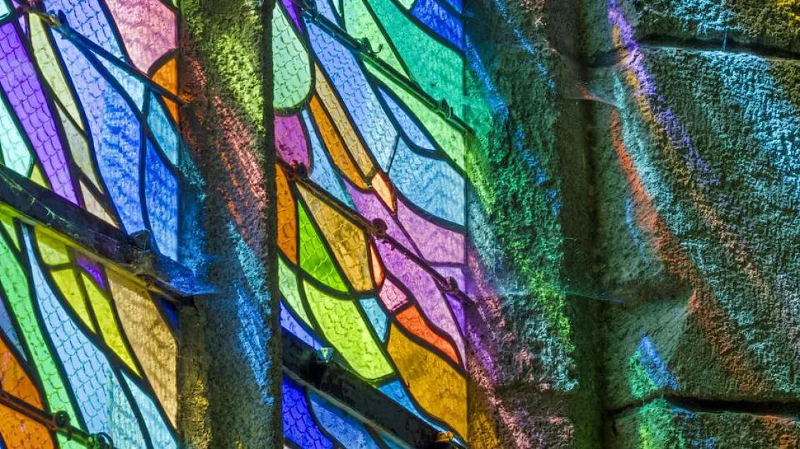 stained glass window in a variety of colors forming a geometric pattern