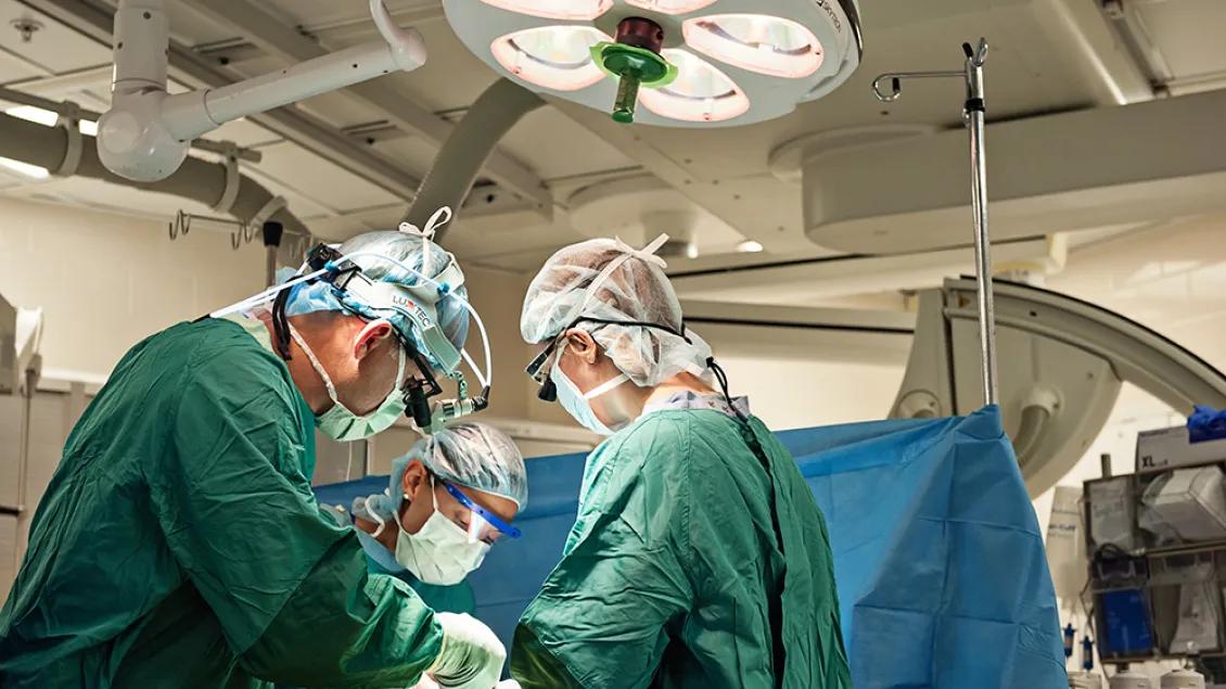 Vascular surgery team members working in the operating room