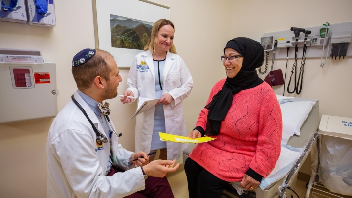  Dr. Hammoud and resident talk to patient