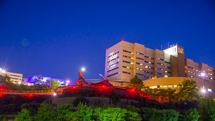 university hospital with helicopter in view