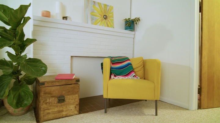 Apartment interior with yellow chair