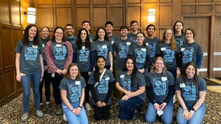 Outreach program group photo wearing matching shirts 