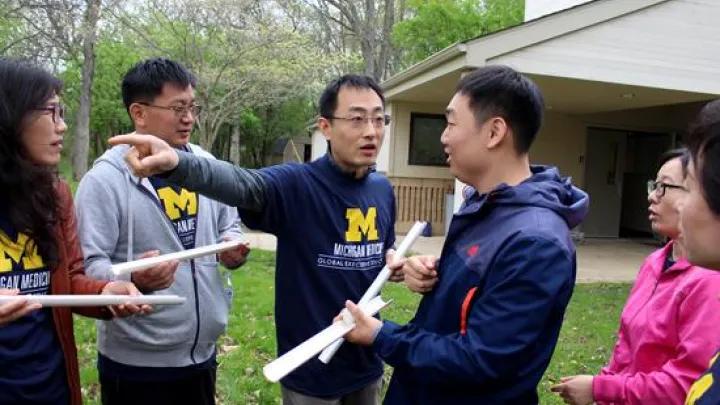 A group of people working on a project outside