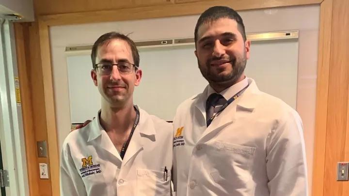 Two men in white lab coats 