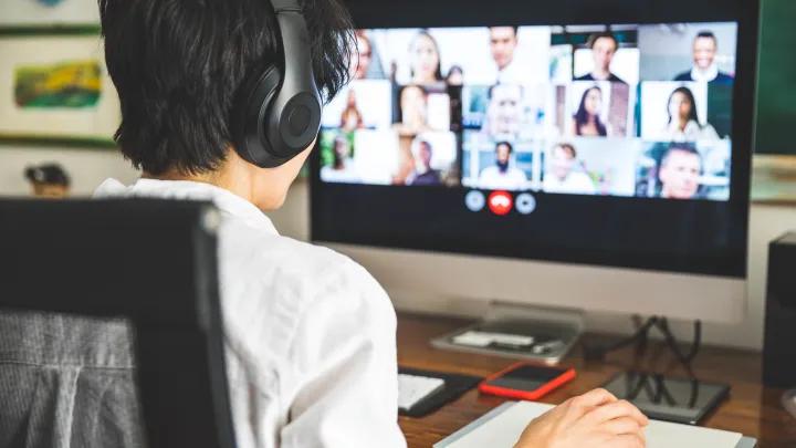Student at a computer participating in a Zoom