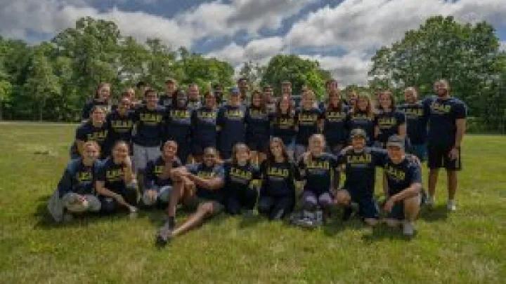 Group photo of students in a field