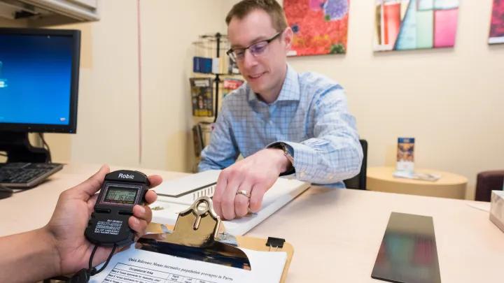 A person working with testing equipment