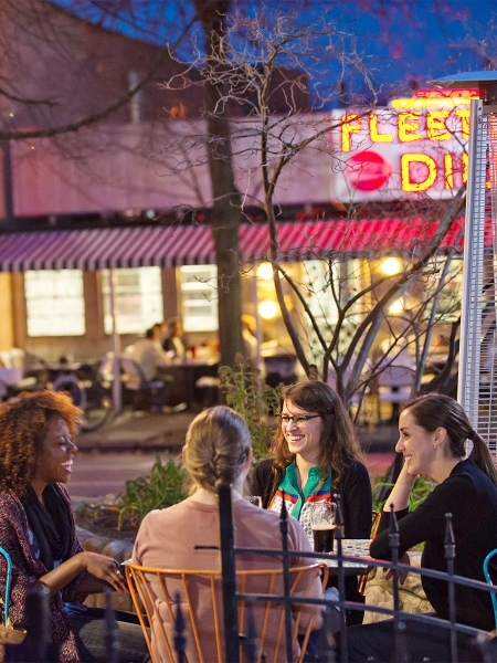 Group of women seated outside at a table in downtown Ann Arbor