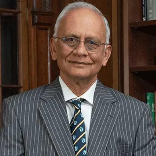 Dr. Mani Menon