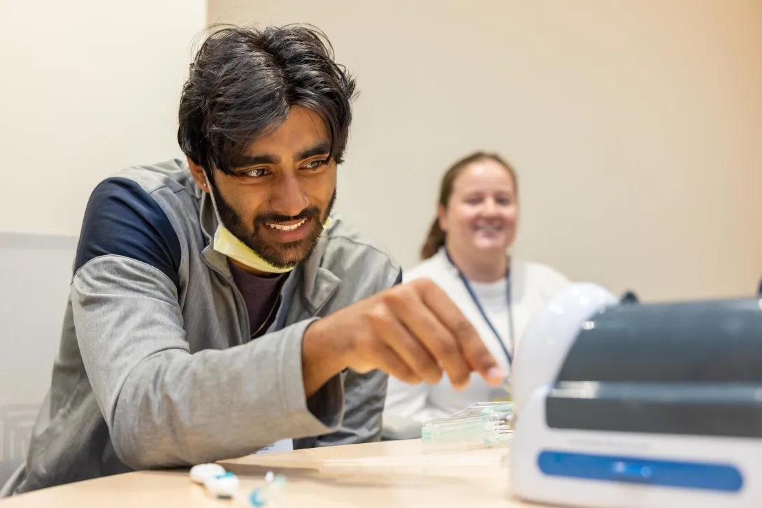 student practices his technique during a lab simulation 