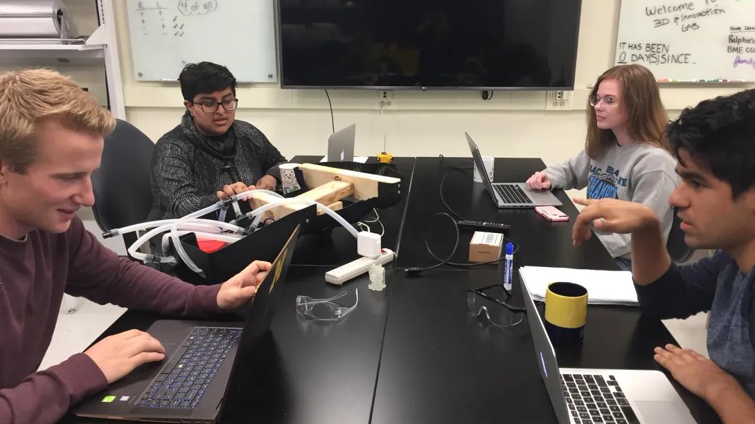 students working at a desk