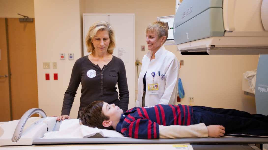 Doctors assessing a young patient 