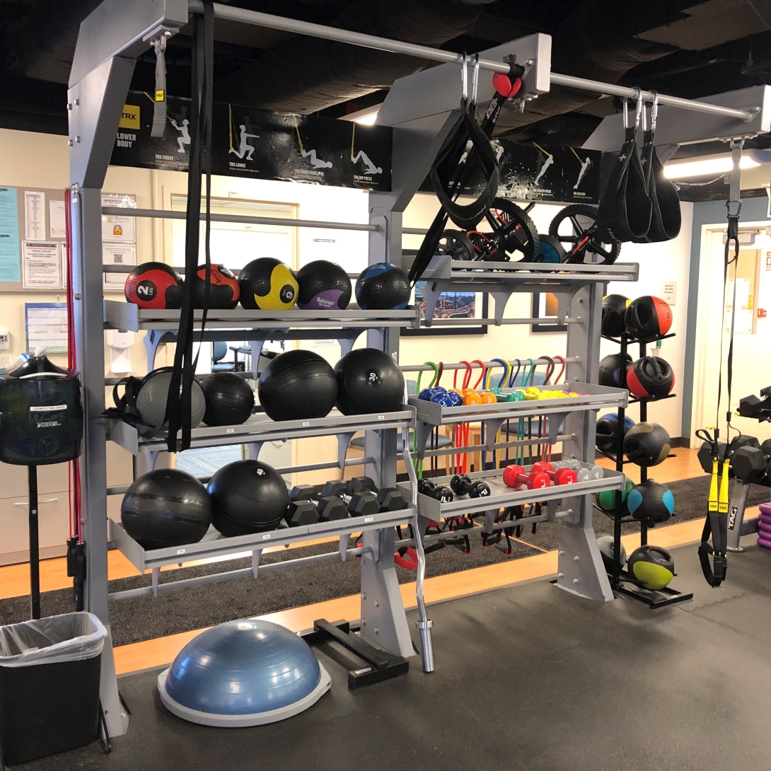 rack with medicine balls and excercise bands 