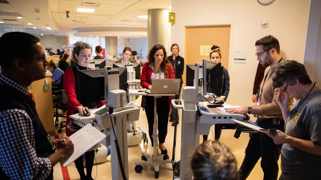 Doctors and residents gather in the halls with their laptops