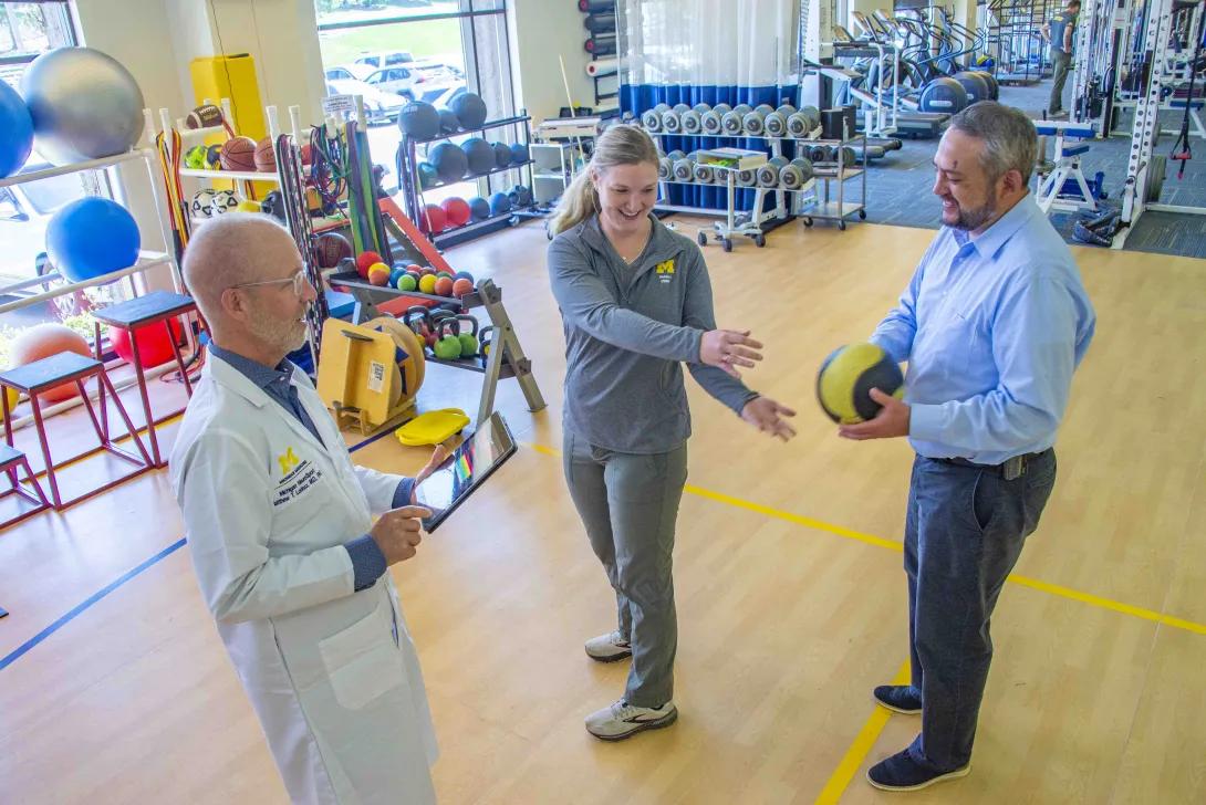 Doctors stands to record observations in the neuro sport training excersises 