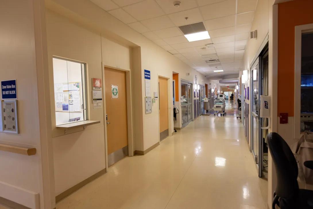 a hallway with doors and signs