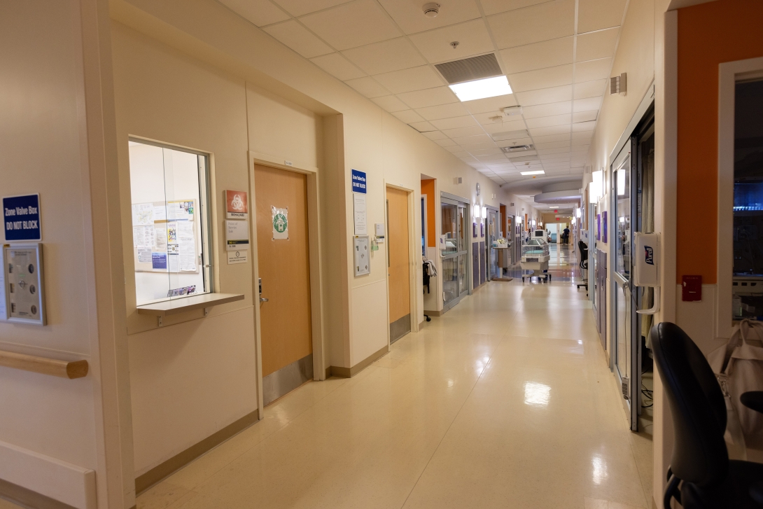 a hallway with doors and signs
