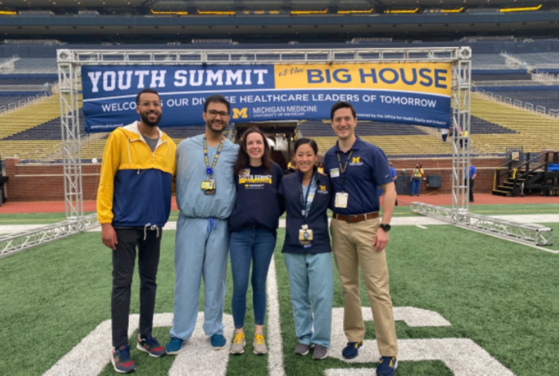 Michigan Orthopaedic Surgery staff poses for a photo in the Big House