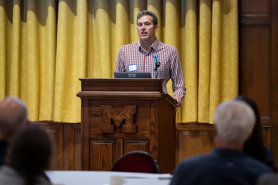 Nicholas Douville, M.D., Ph.D., presents at the podium