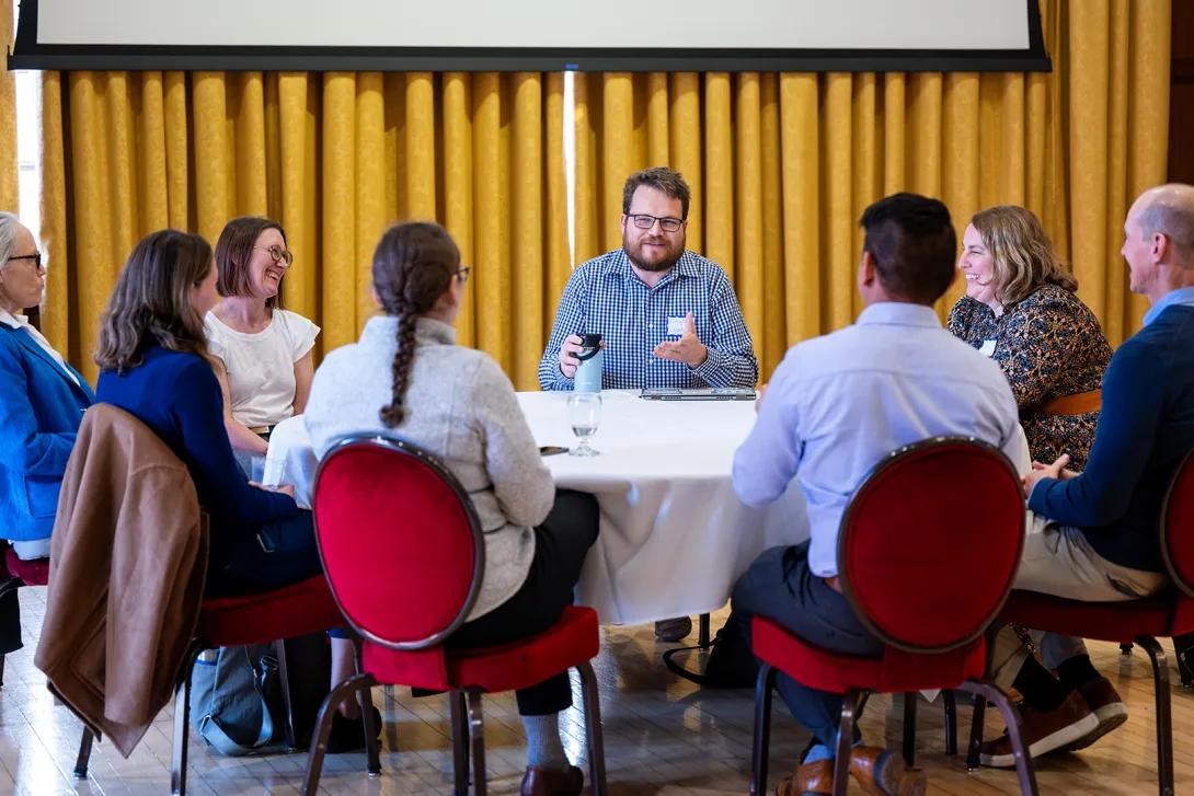 Participants sit a table during an afternoon breakout session