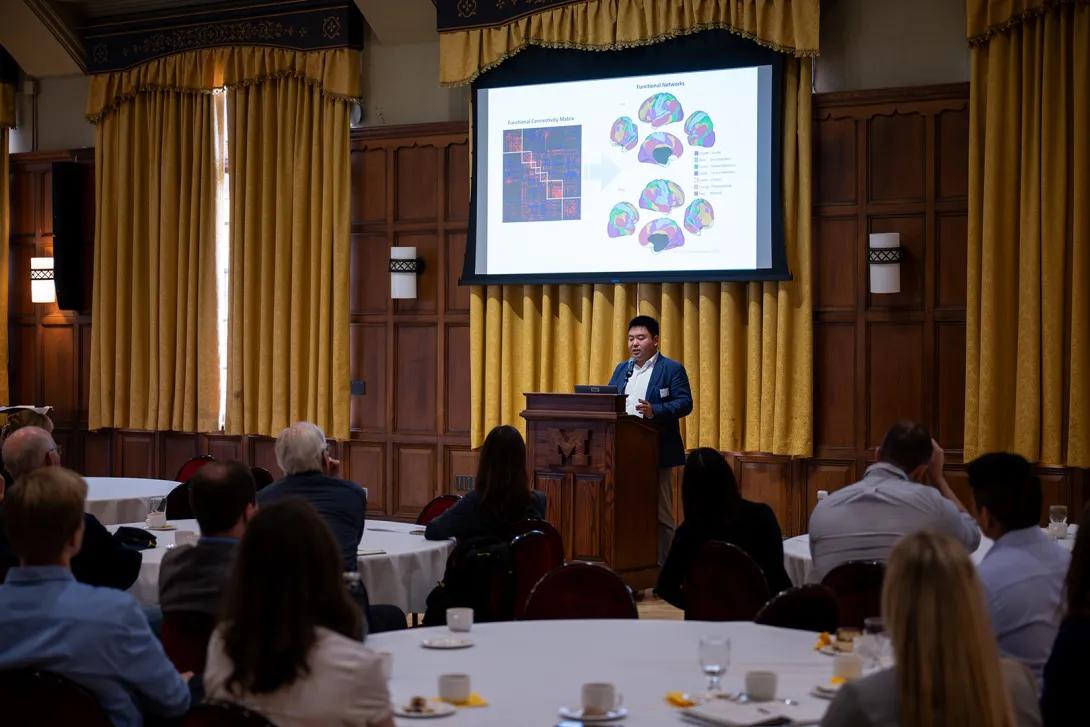 Zirui Huang, Ph.D. presents at the podium