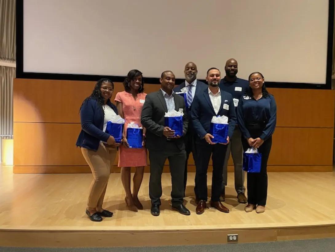 Pharmacology staff poses for a photo at an event