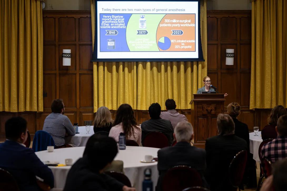 Allison Janda, M.D. presents at the podium