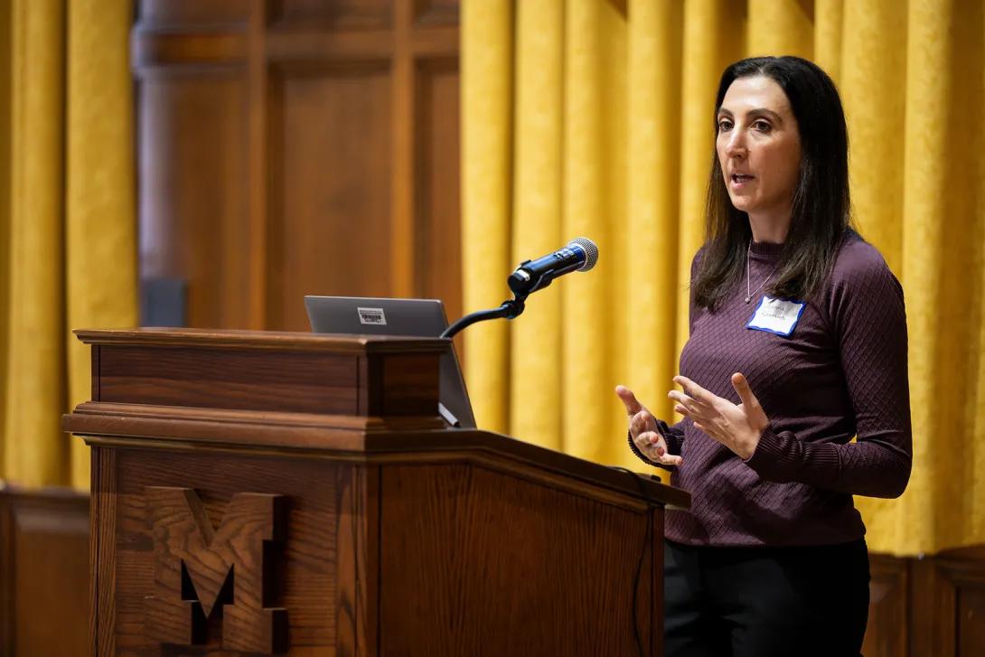 Joanna Kountanis, M.D. presents at the podium