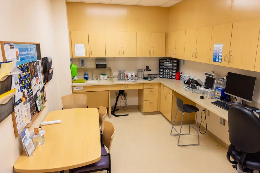 hearing aid fitting room with a desk and chairs
