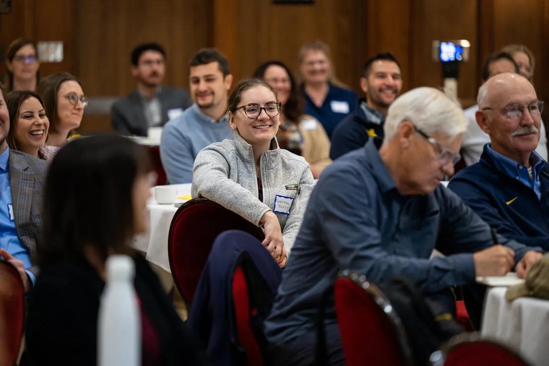 Audience smiles during Anesthesiology presentation