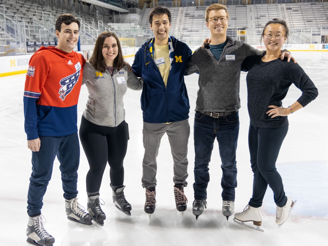 A group of people at an ice skating rink